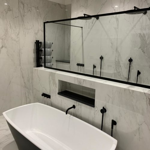 Stunning Marble Wetroom with His and Hers Showers
