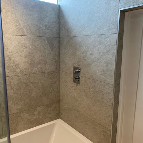 Bath Shower with Grey Tiles