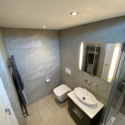 Bath Shower with Grey Tiles
