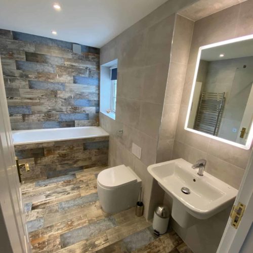 Built in bath with wood plank feature tiles