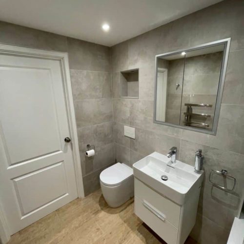 Bath with wall long alcove and strip lighting