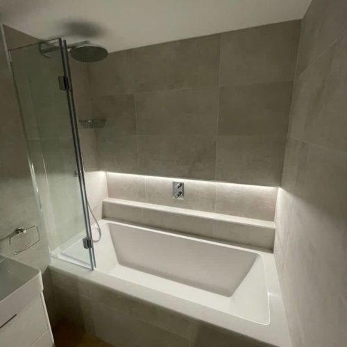 Bath with wall long alcove and strip lighting